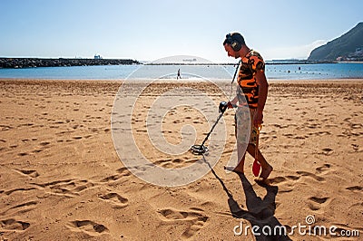 Searching with metal detector Editorial Stock Photo