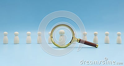 Searching for talent or looking for employee concept using magnifying glass and wooden people Stock Photo