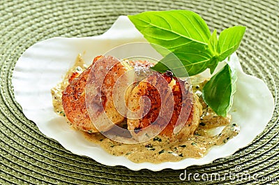 Seared scallops with creamy herb butter sauce Stock Photo