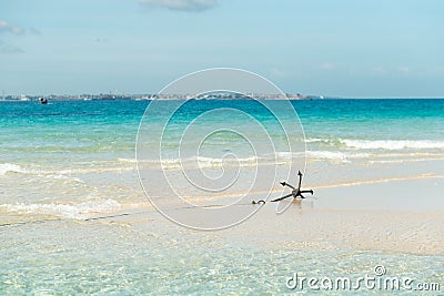 Seascape with anchor on Zanzibar coastline Stock Photo