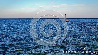 Seascape with black sea birds loafing on the rock Stock Photo