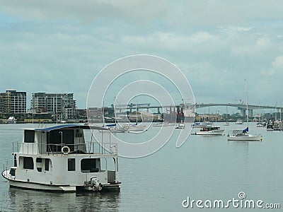 Seascape with bridge and shore with residential houses and harbor Stock Photo
