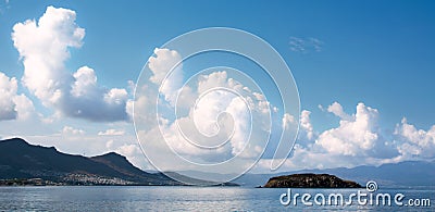 Seascape mountains with beautiful sky in white clouds. Stock Photo