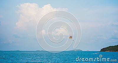 seascape with parasailing and boat under blue sky Stock Photo