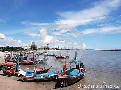 Seascape; Small fishing boat on beach in blue sky Stock Photo