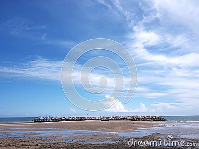 Seascape; Small fishing boat on beach in blue sky Stock Photo