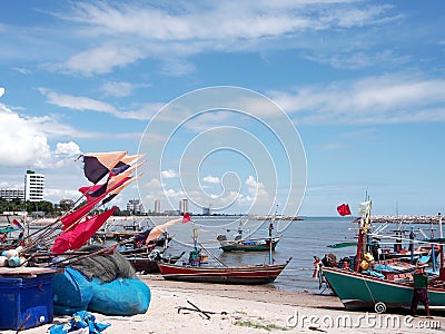 Seascape; Small fishing boat on beach in blue sky Stock Photo