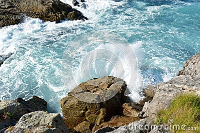 Seascape with waves breaking against the rocks, view from a cliff. Galicia, Spain. Stock Photo