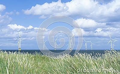 Seascape Windmill farm in the ocean, Row of floating wind turbines, Landscape offshore wind turbines in Middlebrough, United Stock Photo