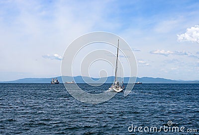 Seascape. The yacht goes to sea Stock Photo