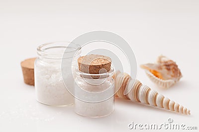 seashell and jar of salt on white Stock Photo