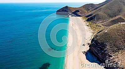 Seashore, coastline, scenic view of people at unspoiled beach in Almeria, called Playa de los Muertos, Stock Photo