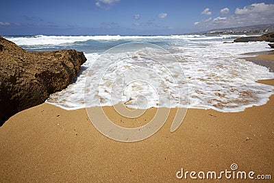 Seashore foam spume wave in the sand Stock Photo
