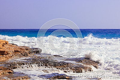 Seashore Waves and Mountain under the Sunshine in Matrouh, Egypt Stock Photo