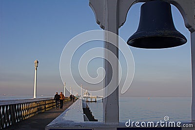 Seaside pier, with ships bell Stock Photo