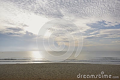 Seaside sunset with clouds Stock Photo