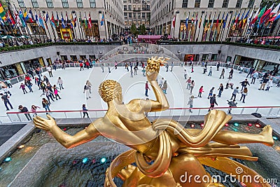 Seasonal ice skating rink with a golden statue at Rockefeller Center, Manhattan, New York, USA Editorial Stock Photo