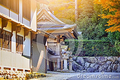 Seasonal Red Maples in Front of The Monastery Gates on Sacred Mount Koyasan in Japan Stock Photo