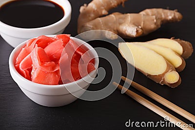 Seasoning for sushi: Soy sauce and pickled ginger close-up. horizontal Stock Photo