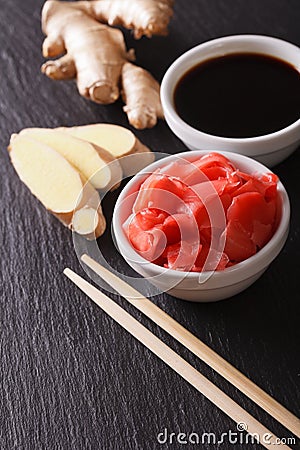 Seasoning for sushi: Soy sauce and pickled ginger. vertical Stock Photo