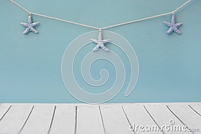 Seastars on the fishing net on a blue background Stock Photo