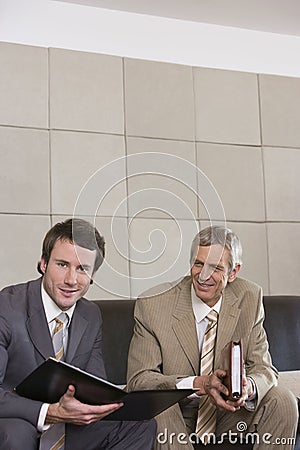 Seated businessmen Stock Photo