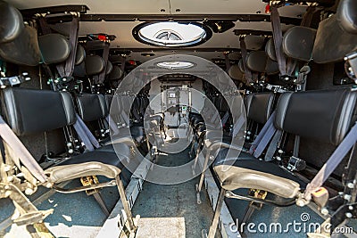 Seatings inside an armored military vehicle for carrying soldiers Stock Photo