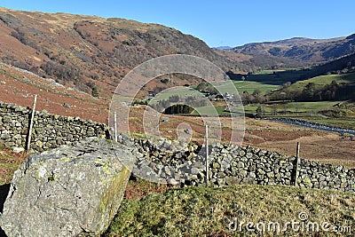 Seatoller valley viewed by large boulder Stock Photo