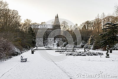 Seaton park central alley and St Machar`s Cathedral covered by snow in winter season, Aberdeen, Scotland Stock Photo