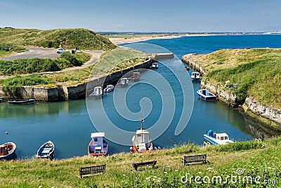 Seaton Sluice Harbour, a small inlet in Northumberland, Northern England with small boats. Stock Photo