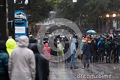 Seattle rioters on May 30 watching a police car burn Editorial Stock Photo