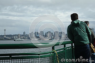 Passengers onboard the Bremerton-Seattle Washington State Ferry admire the Seattle Skyline Editorial Stock Photo