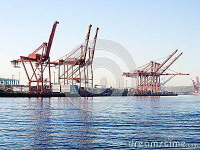 Cargo cranes at the port of Seattle at sunset Editorial Stock Photo