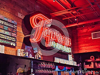 Close up, selective focus on a neon sign at Taproom At Pike Place bar Editorial Stock Photo