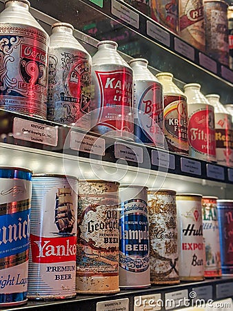Close up, selective focus on old vintage beer cans inside a display case at the Taproom Editorial Stock Photo