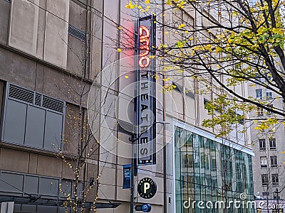 View of the outdoor neon sign for AMC movie theater in downtown Seattle on an overcast Editorial Stock Photo