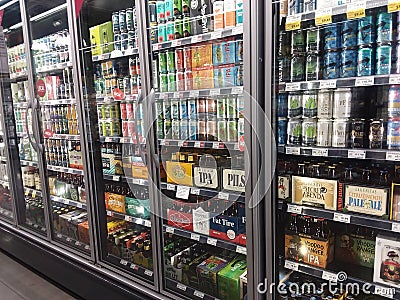 Beer and liquor fridge display inside a Whole Foods grocery store Editorial Stock Photo