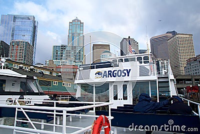 SEATTLE, WASHINGTON, USA - JAN 25th, 2017: Seattle skyline and waterfront at Pier 55, viewed from the water of Puget Editorial Stock Photo