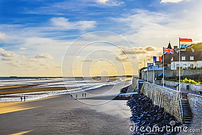 Seawall Beach Flags Mulberry Harbor Arromanches-les-Bains Normandy France Stock Photo