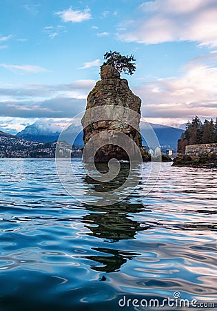 Seawall in Stanley Park. Cloudy Sunrise in Winter. Downtown Vancouver Stock Photo
