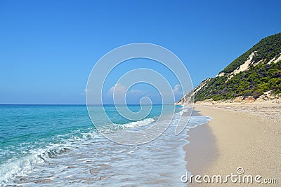 Secluded sandy beach in quiet sunny day with calm turquoise sea Stock Photo