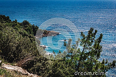 Secluded unnamed tiny perfect beach along the Aegean coast Stock Photo