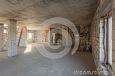 The second attic floor of the house. overhaul and reconstruction. Working process of warming inside part of roof. House Stock Photo