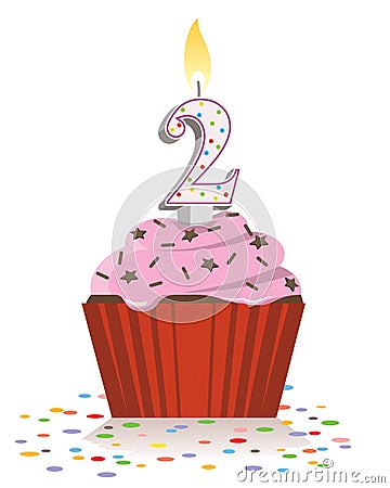 Second birthday cupcake with lit candle in shape of number two Stock Photo