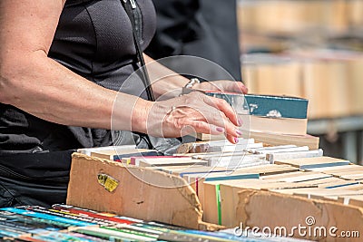 Second Hand Book Stall. Woman Buying Books Stock Photo
