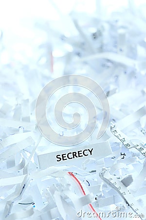 Secrecy written on shredded paper Stock Photo