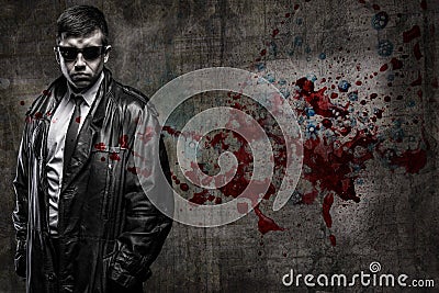 Secret agent man on bloody wall background Stock Photo