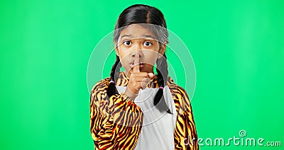 Secret, green screen and face of a child in studio with her finger on her lip for a quiet gesture. Noise, young and Stock Photo