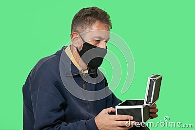 Man in black mask isolated on green screen background Stock Photo