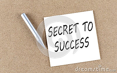 SECRET TO SUCCESS text on a sticky note on cork board with pencil Stock Photo